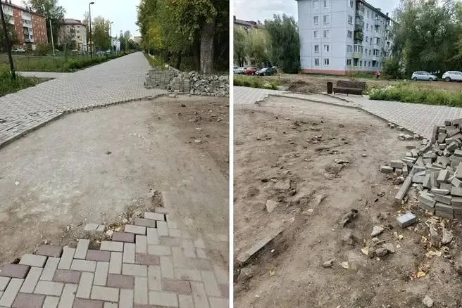 Пешеходная зона у школы выглядит как стройплощадка: снятая плитка, разрыв грунта и песок, ситуация длится около трёх месяцев.